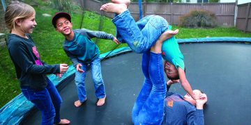 The children of April and Rubin Doster, from left: Savannah, 8, Jackson, 9, Derek, 5 and Mya, 11, play on a trampoline in the backyard of their Palmyra home on Tuesday, Nov. 5, 2019.